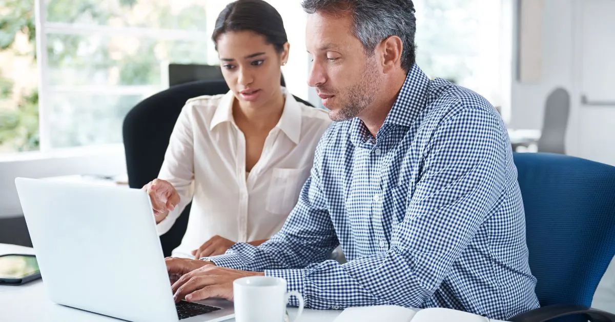 woman and man on computer